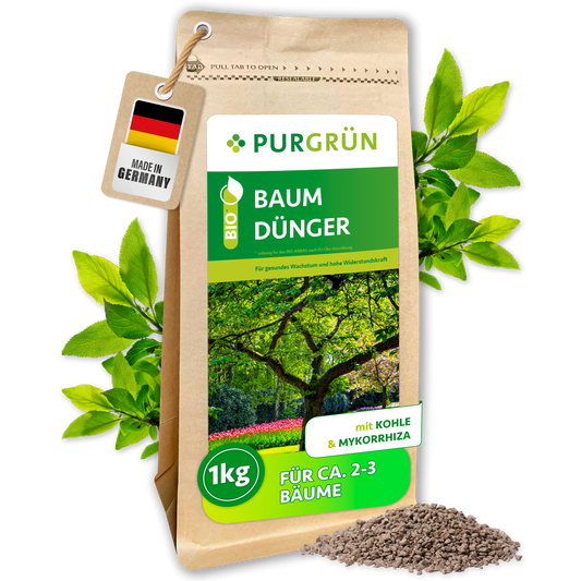 Purgrün Bio-Baumdünger im wiederverschließbaren 1-kg-Beutel, mit Pflanzenkohle und Mykorrhiza; Granulat liegt davor.