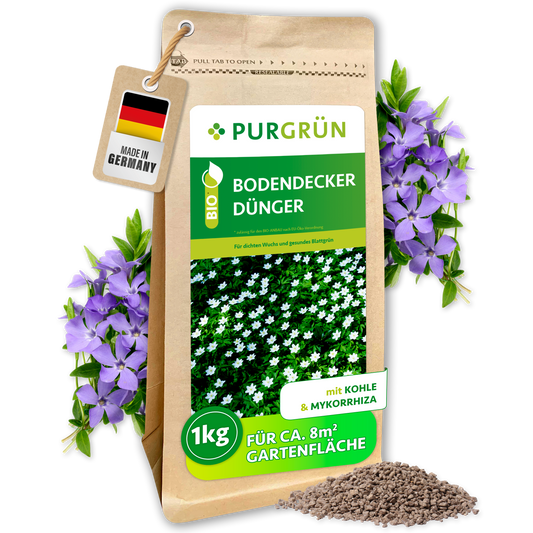Bio-Bodendecker-Dünger im 1-kg-Beutel mit Pflanzenkohle und Mykorrhiza, ausreichend für ca. 8 m² Gartenfläche.