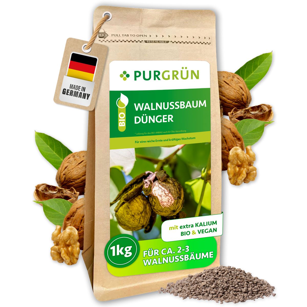 Purgrün Bio-Walnussbaum-Dünger im 1-kg-Beutel, umgeben von Walnüssen, grünen Blättern und feinem Granulat.