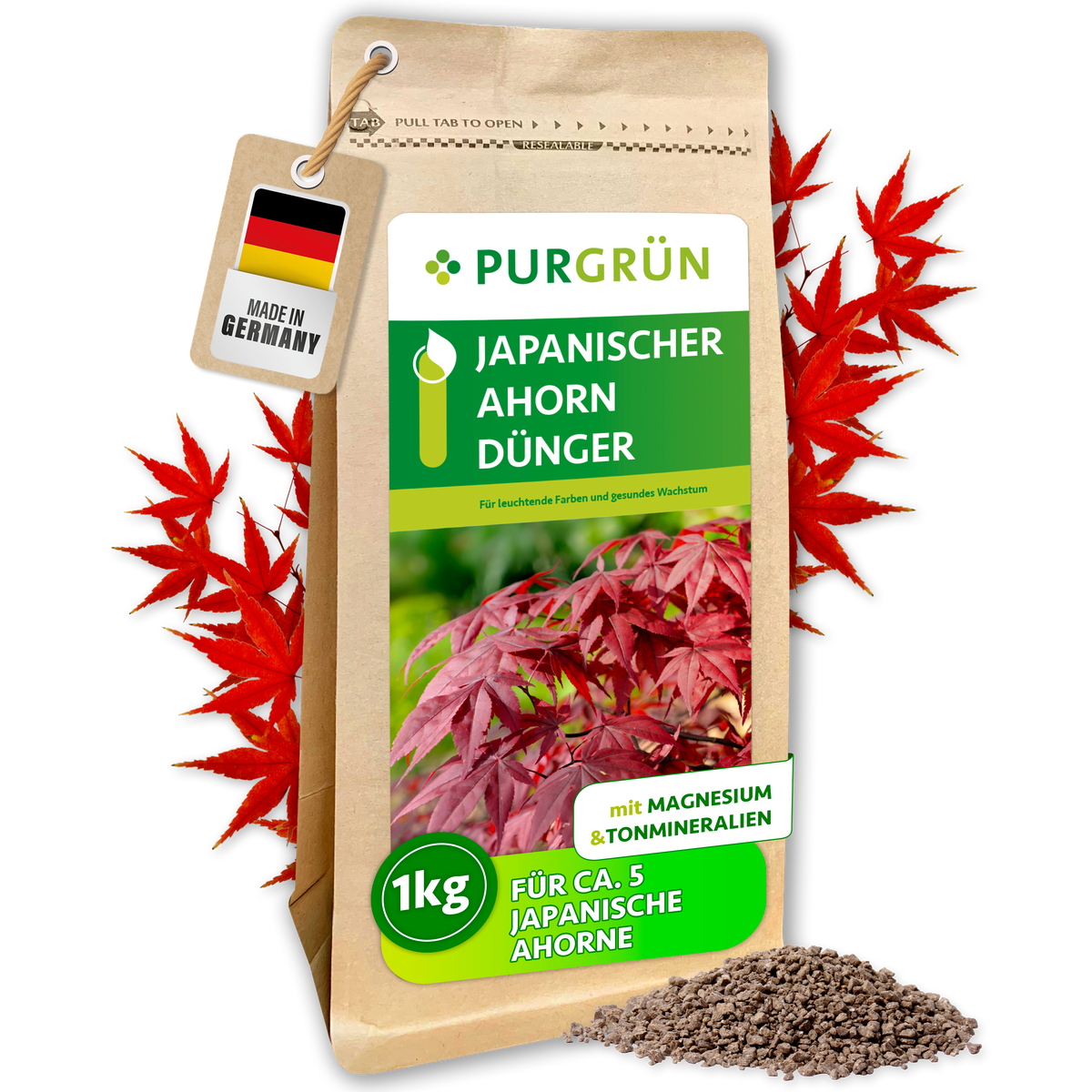 Purgrün Japanischer-Ahorn-Dünger im 1-kg-Beutel, umrahmt von roten Ahornblättern, mit Granulathaufen und „Made in Germany“-Anhänger.