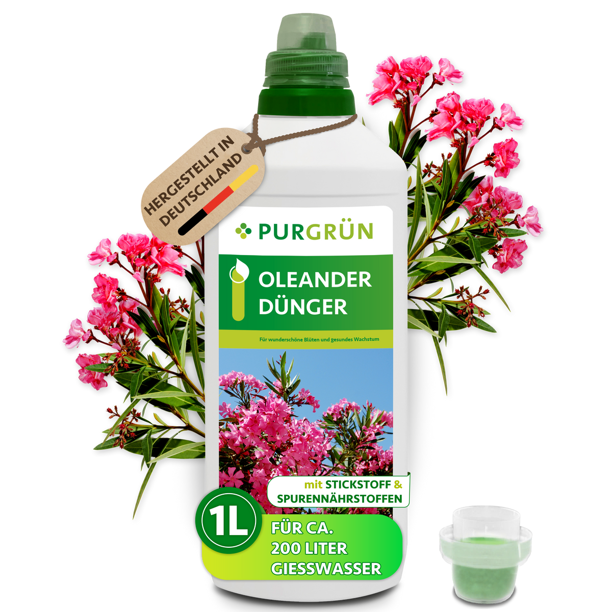 Purgrün Oleander-Dünger in der 1-Liter-Flasche mit Dosierkappe vor rosa Oleanderblüten, für ca. 200 Liter Gießwasser.