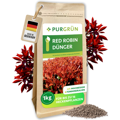 Packung Purgrün Red-Robin-Dünger, 1 kg, mit Granulat und roten Glanzmispelblättern sowie „Made in Germany“-Anhänger.