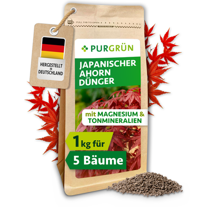 Purgrün Japanischer-Ahorn-Dünger im 1-kg-Beutel, umrahmt von roten Ahornblättern, mit Granulathaufen und „Made in Germany“-Anhänger.
